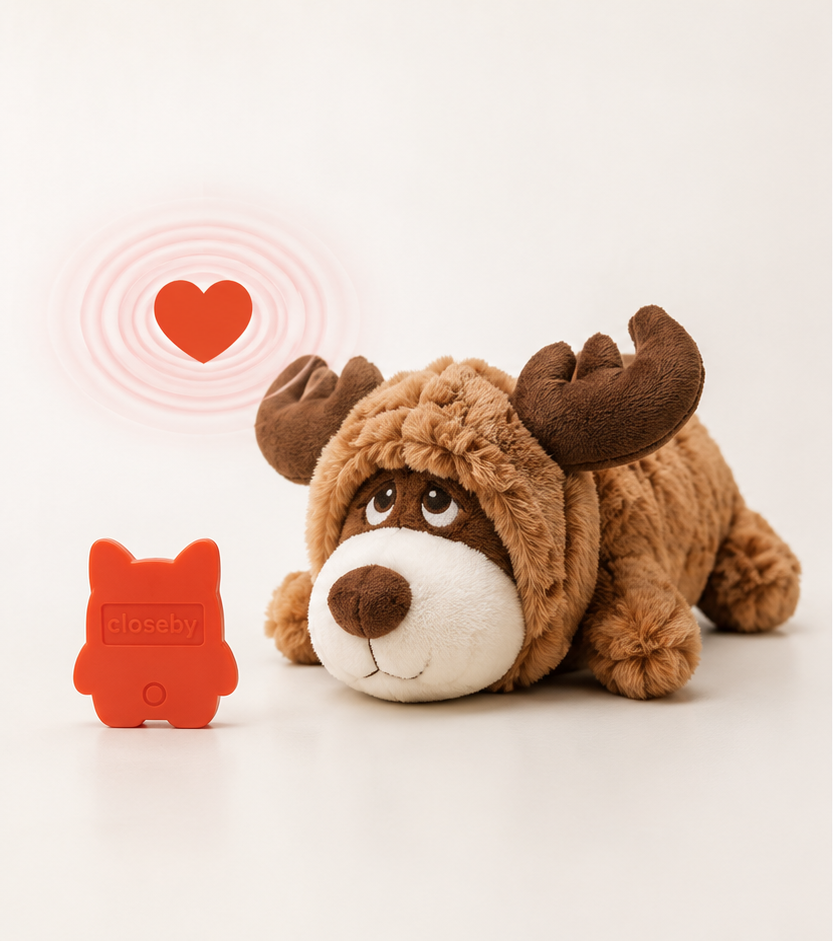 CloseBy moose plush awake beside the orange heart insert with pulse rings
